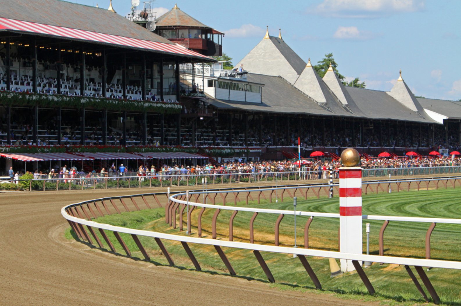 The historic grandstand and crowd at the Saratoga Race Course on a summer race day