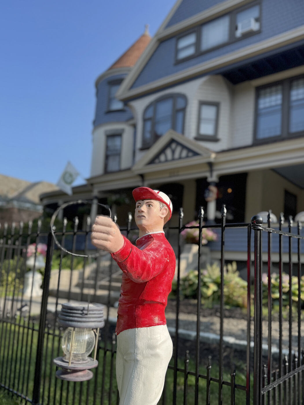 A lawn jockey stands watch at the Union Avenue Thoroughbred Club