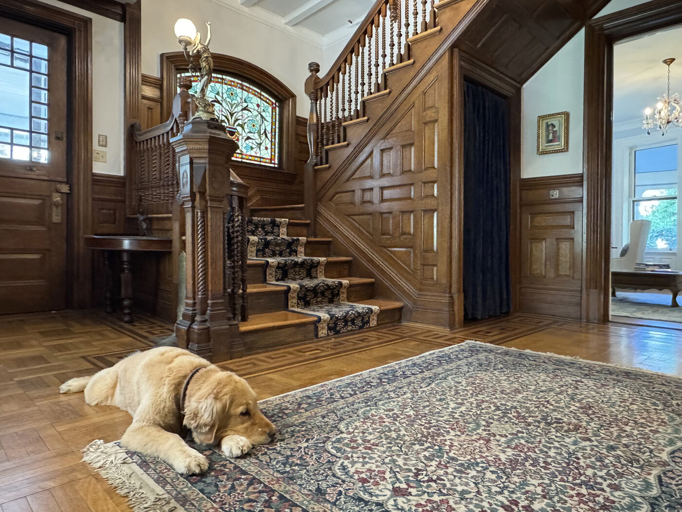 The hall clock and the staircase at the Union Avenue Thoroughbred Club