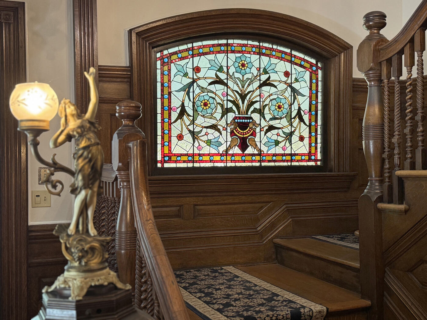 Stained glass at the stair landing at the Union Avenue Thoroughbred Club